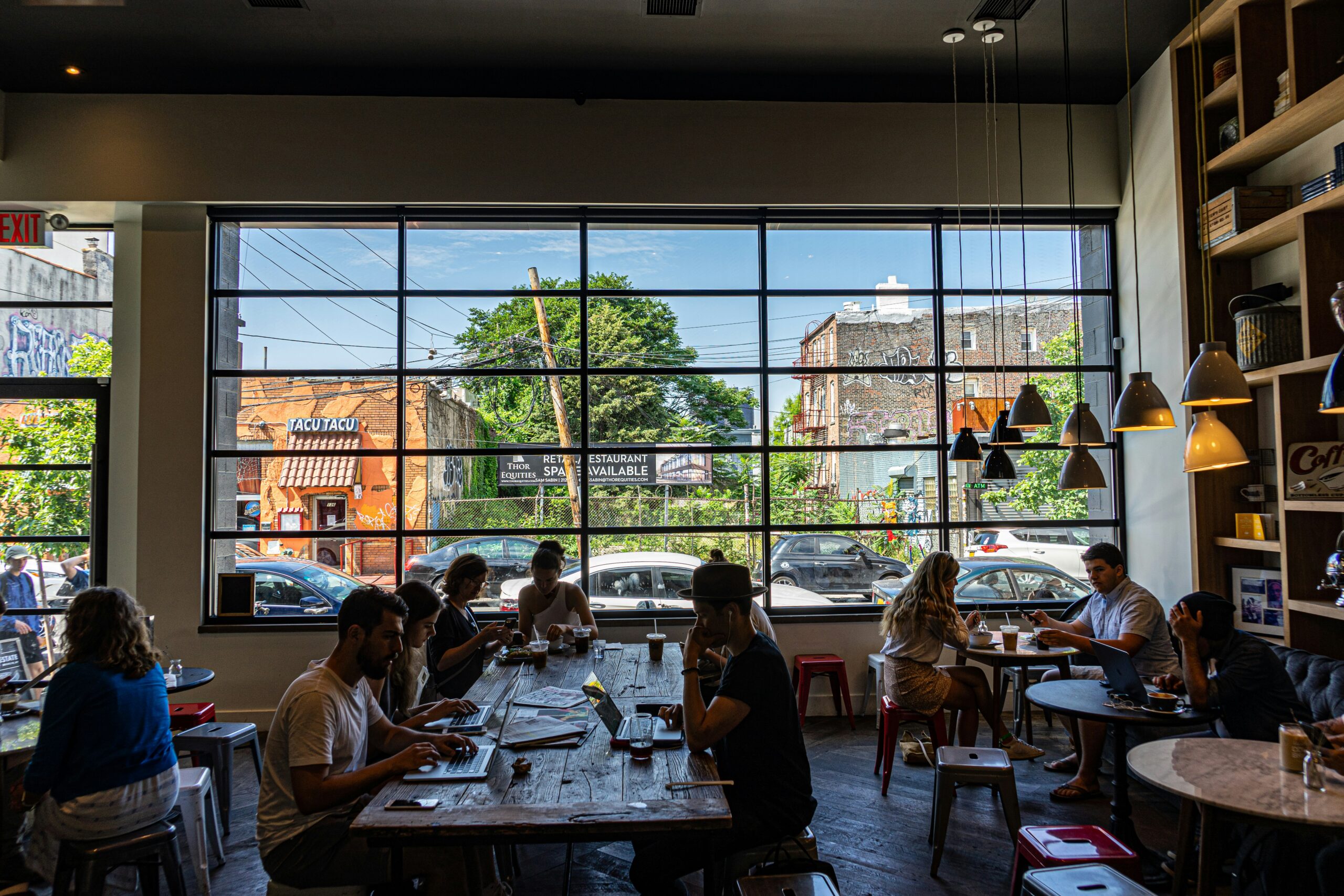 people sitting on chair in restaurant during daytime